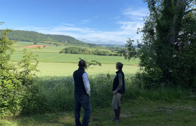 A farmer chatting to pinstone about agricultural pr
