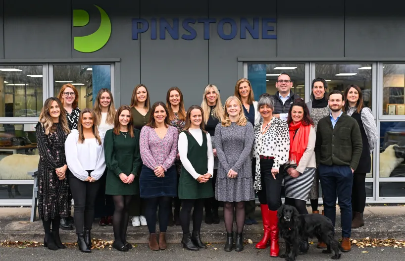 Pinstone team in front of their office