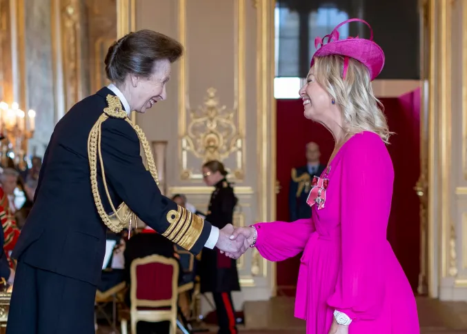 Margot Raggett recieving her MBE