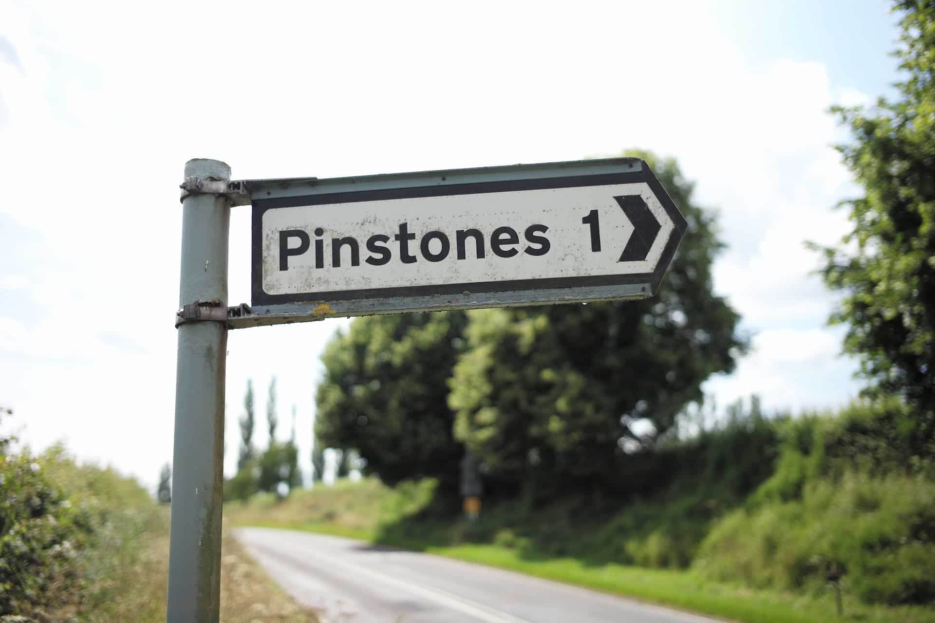Pinstone Sign