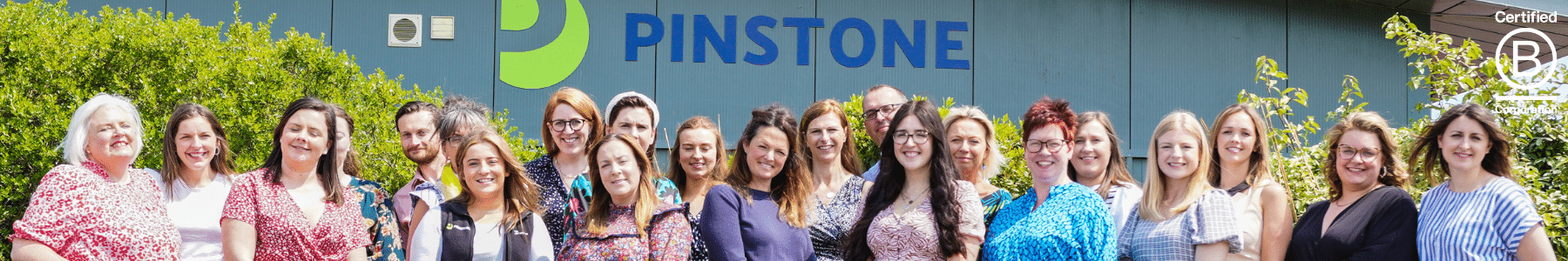 Pinstone team celebrate becoming B Corp certified
